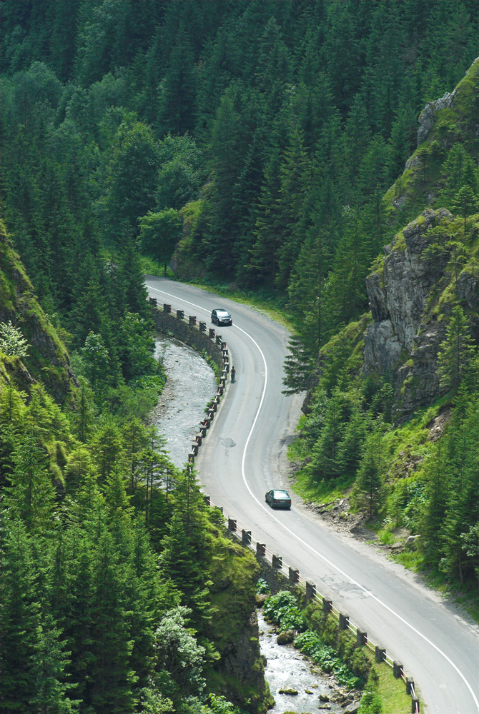 2 cars driving through the narrow passage of the Vratna Gorge, Slovakia