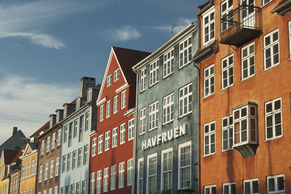 A row of colourful buildings in Nyhavn, Copenhagen, Denmark.